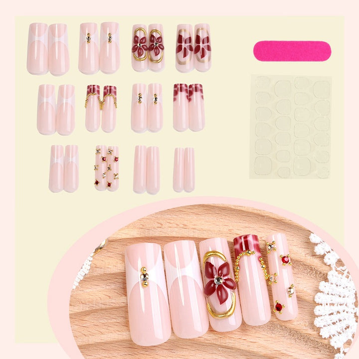Artificial nail set with floral decorations and elegant accents Stornfield