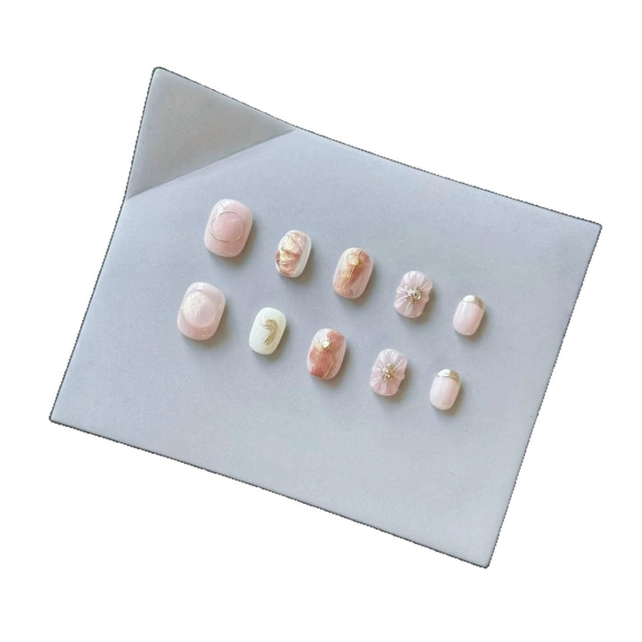 Artistic Press-On Nail Set with Decorative Floral Accents