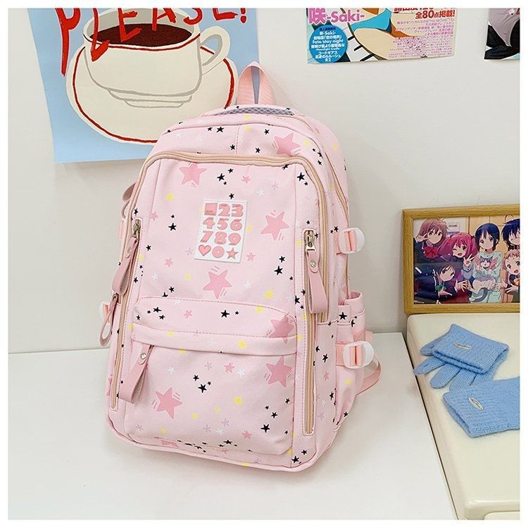 Playful backpack with star motifs and practical functions Stornfield