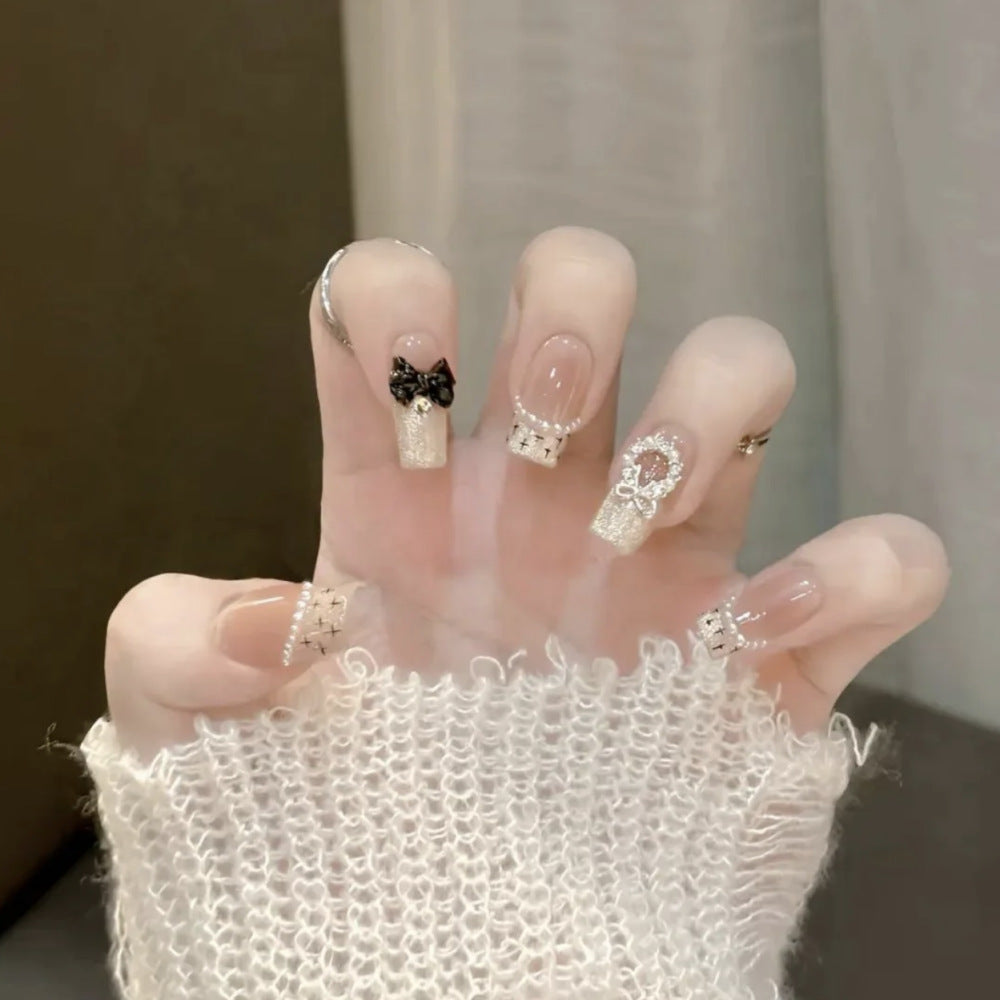 Glamorous artificial nails with sparkling decorations Stornfield