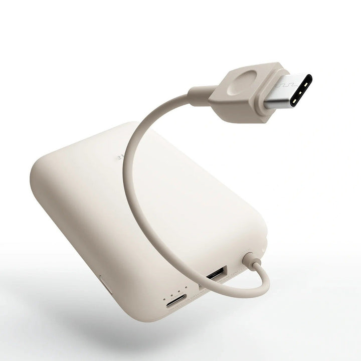 Compact High-capacity portable power bank with integrated USB-C cable and silicone carry loop Stornfield
