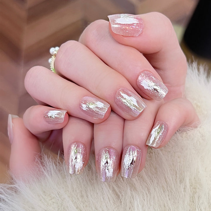 Artificial nail extensions with elegant gold design Stornfield