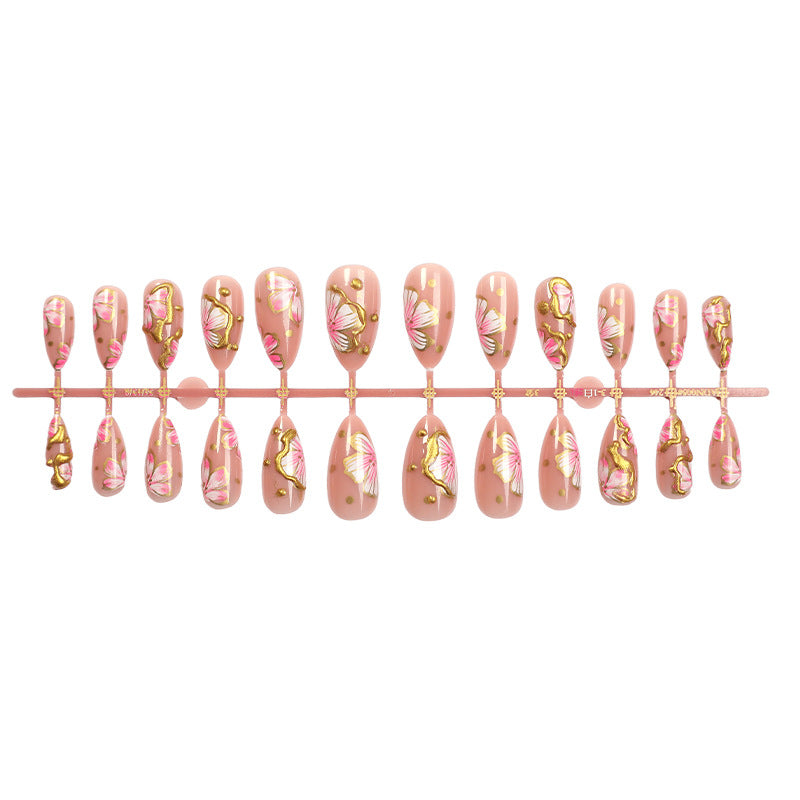 Artificial nails with graceful floral patterns and golden accents Stornfield