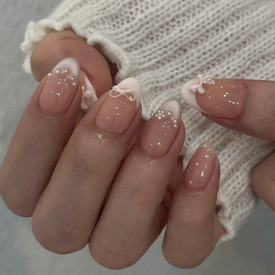 Artificial nail art with playful dots and bows Stornfield