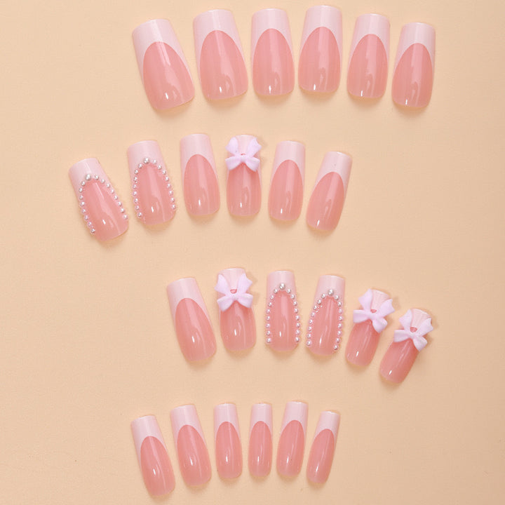 Artificial nails with delicate flower and pearl embellishments Stornfield