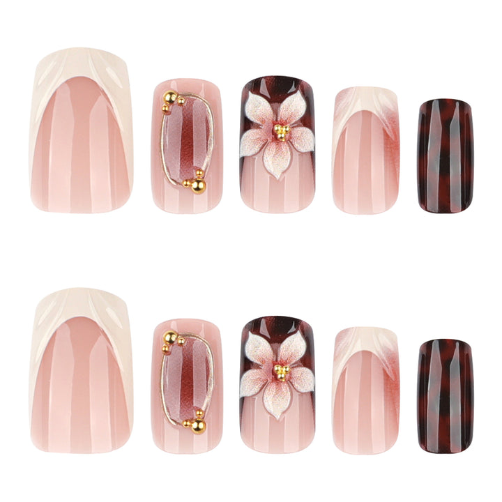 Artistic stiletto nails with elegant floral design and glitter effects Stornfield