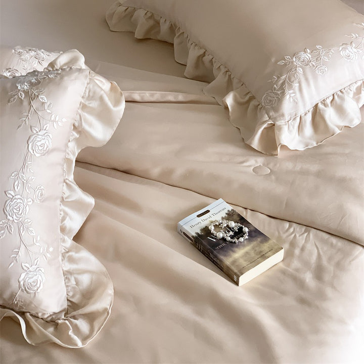 Satin bedding set with ruffled hem and fine rose embroidery