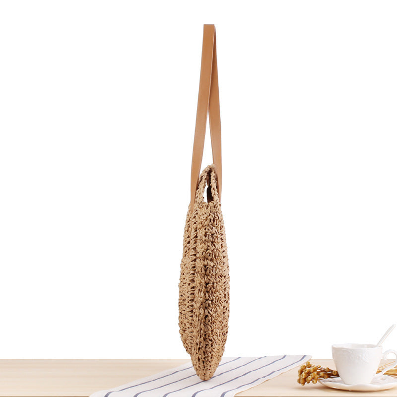 Round straw bag with leather handles Stornfield