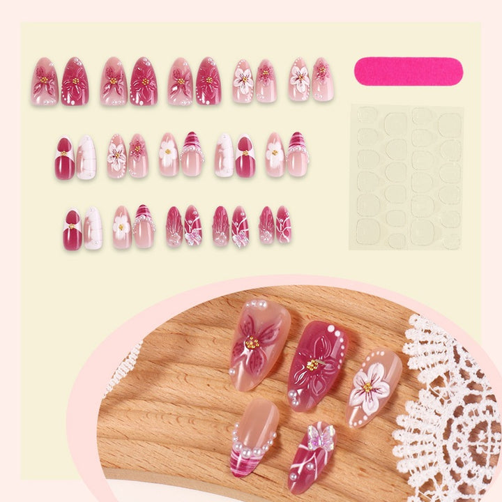 Artificial nail set with floral decorations and elegant patterns Stornfield