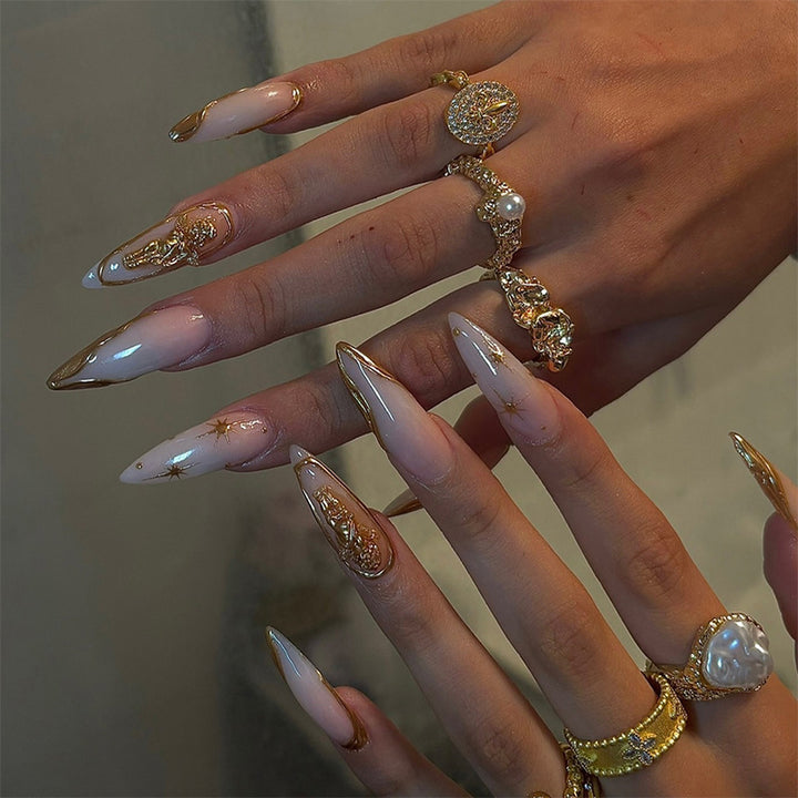 Artificial Nail Set with delicate golden accents and glitter motifs Stornfield