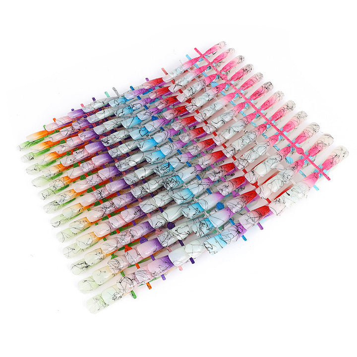 Artificial nails in modern ombre design with marbled accents Stornfield