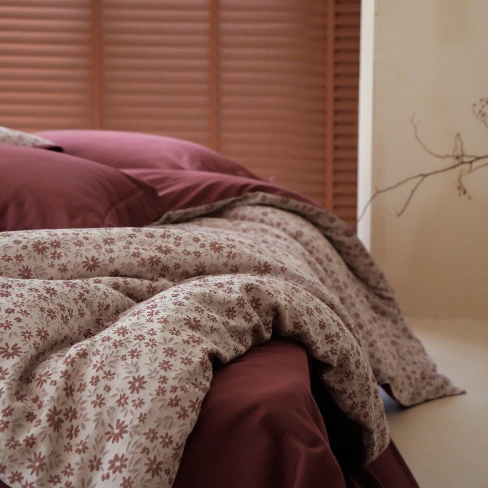 Luxurious bedding set with floral microprint percale and satin finish back