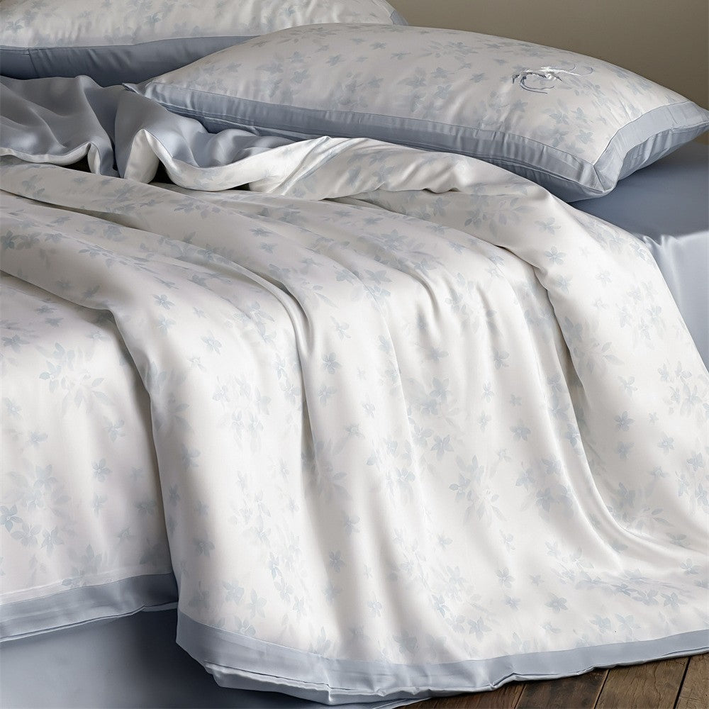 High-quality cotton satin bed set with delicate flower print and fine piping edge