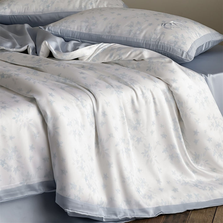 High-quality cotton satin bed set with delicate flower print and fine piping edge