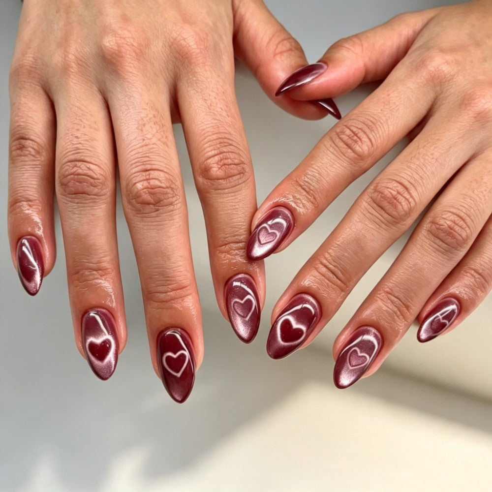Artificial nails with luxurious heart design and shimmering finish Stornfield