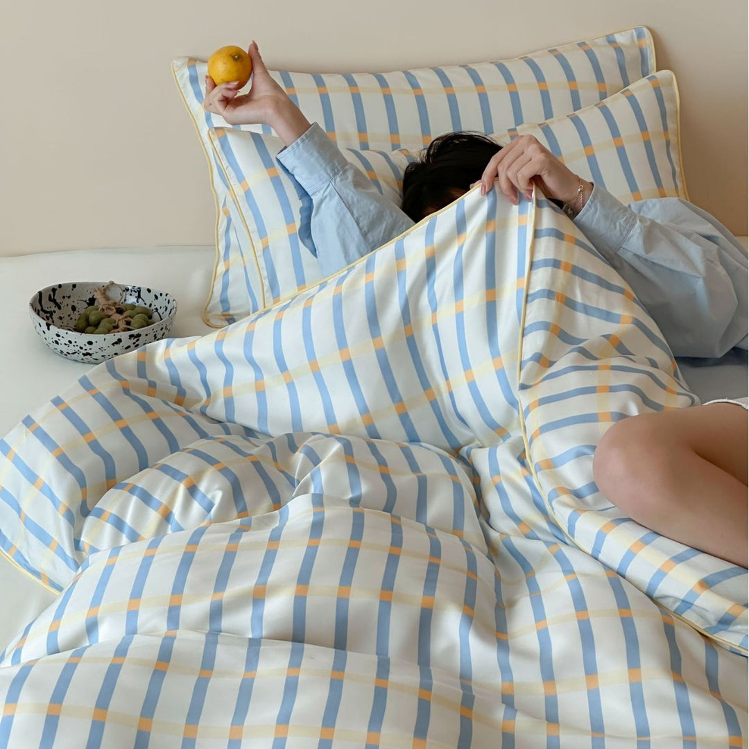 Soft cotton satin bedding with fine check and stripe pattern