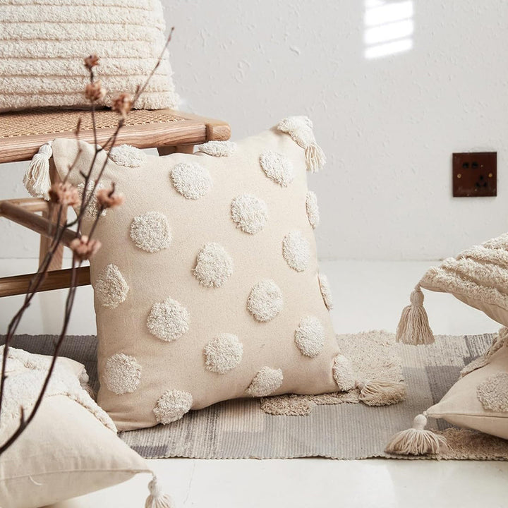 Square cotton-linen cushion cover with 3D pompom tufting and corner tassels Stornfield