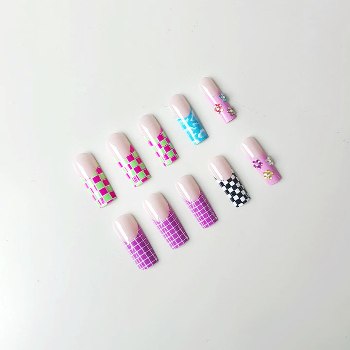 Nail art set with creative designs and shimmering accents Stornfield