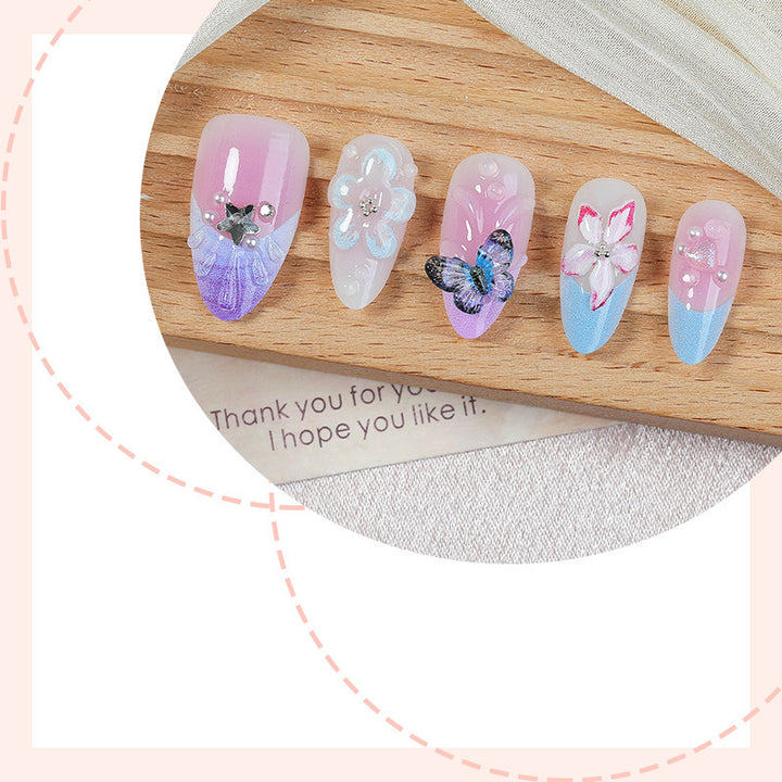 Creative nail art set with floral and butterfly motifs Stornfield