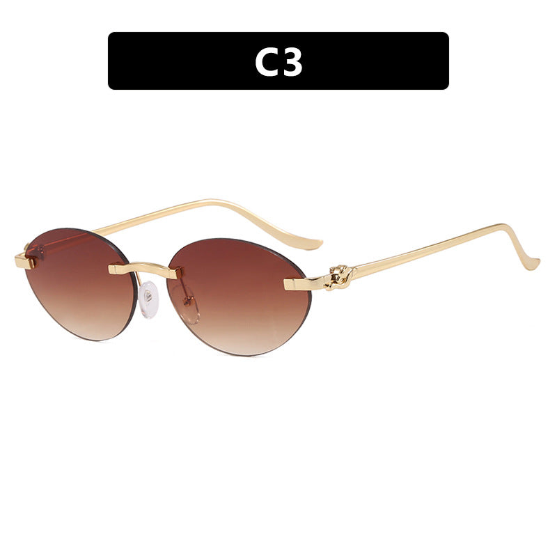 Women's elegant oval sunglasses with golden accents Stornfield