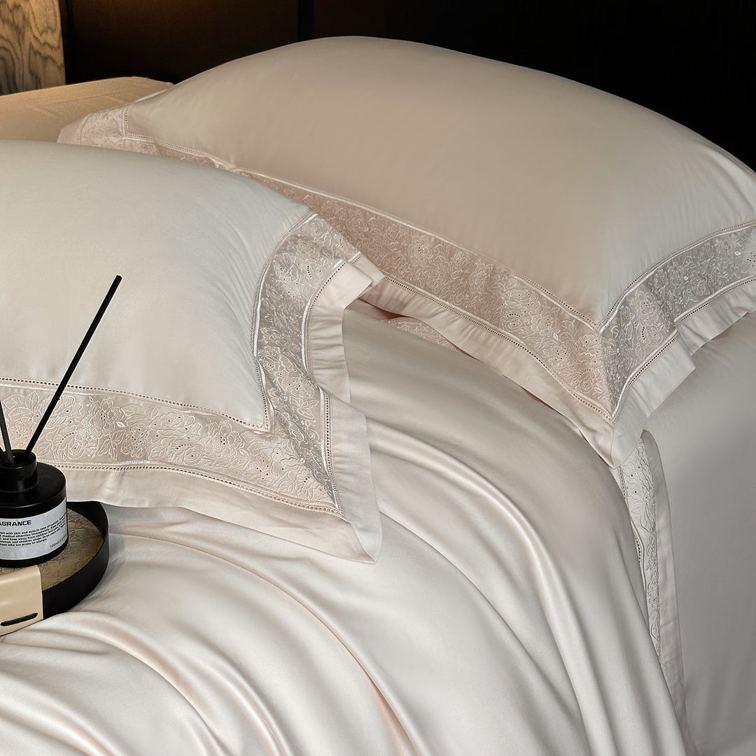 Premium cotton satin bedding set with integrated lace trim and delicate floral embroidery