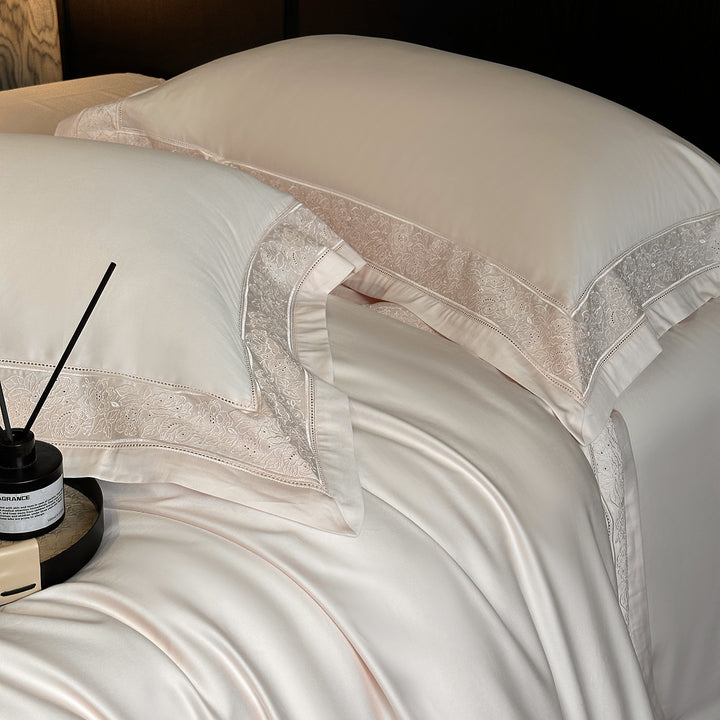 Premium cotton satin bedding set with integrated lace trim and delicate floral embroidery