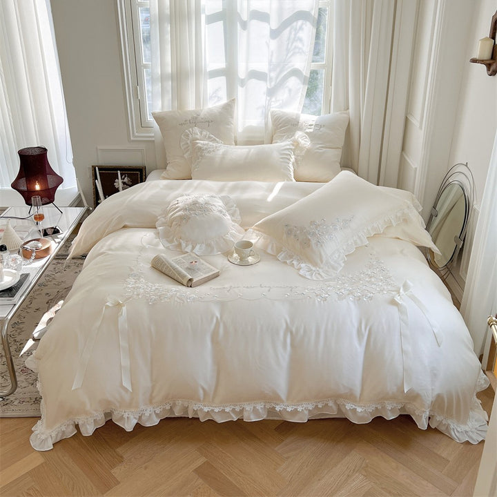 Victorian-inspired cotton satin bedding set with lace ruffles and bows