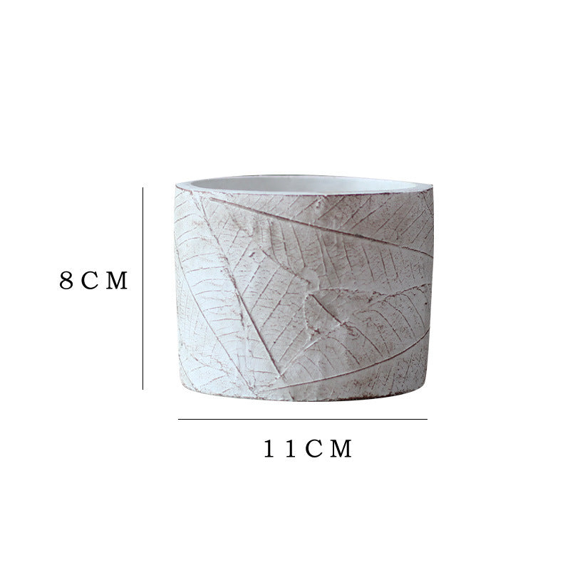 Decorative plant container made of handmade ceramic with leaf pattern Stornfield