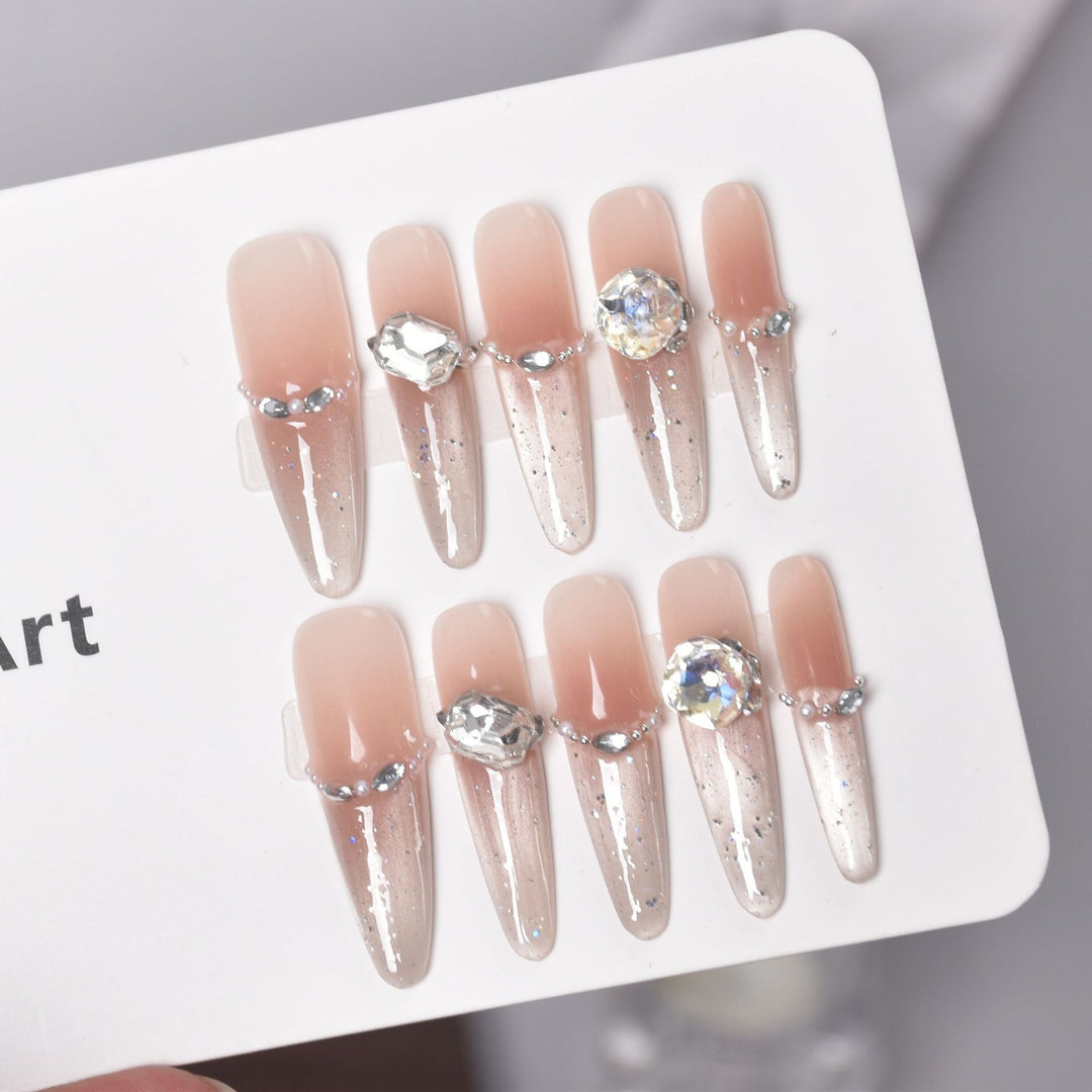 Artistic Stiletto Press-On Nail Art with Glimmering Accents Stornfield