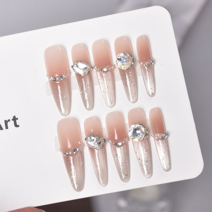 Artistic Stiletto Press-On Nail Art with Glimmering Accents Stornfield