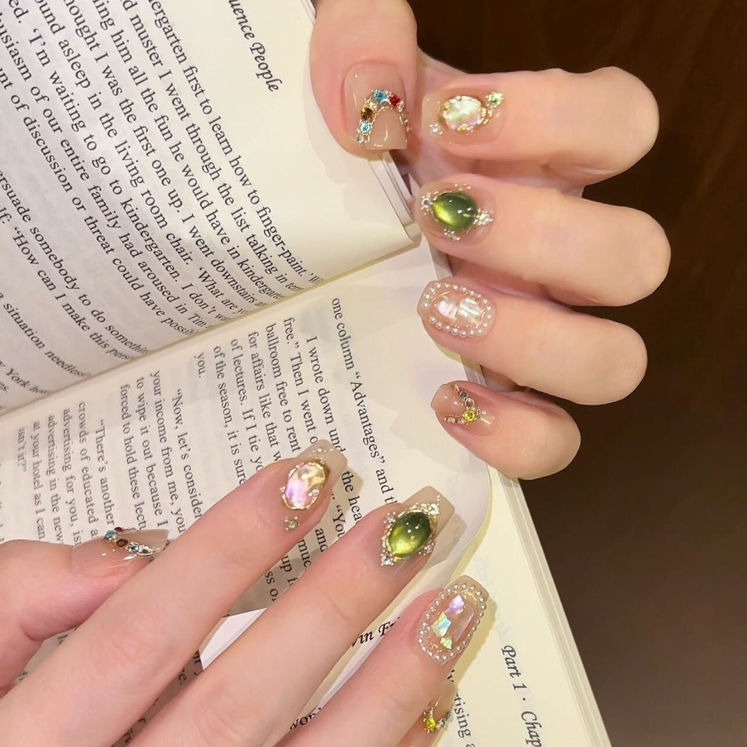 Artificial nails with rhinestone and pearl accents Stornfield