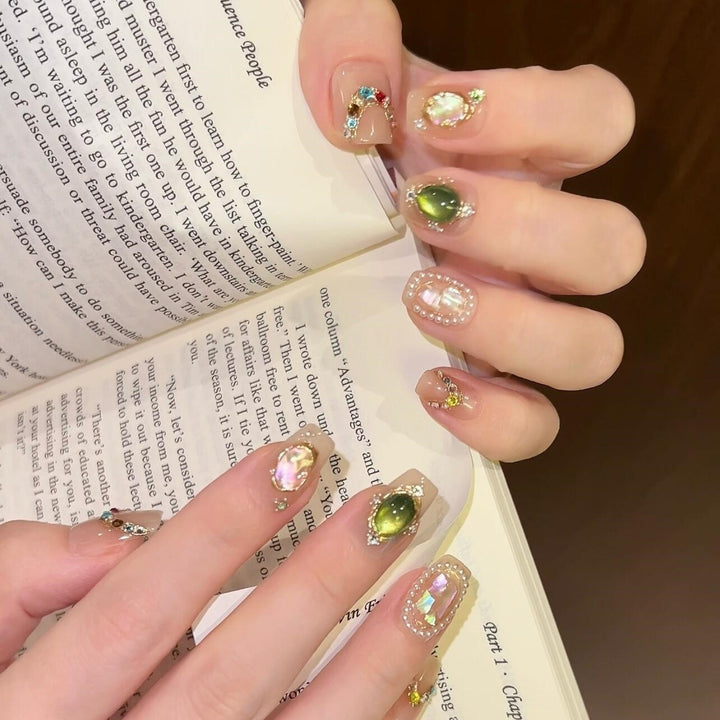 Artificial nails with rhinestone and pearl accents Stornfield