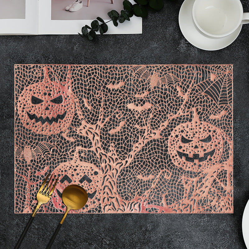 Halloween plastic table mats with intricate pumpkin and spider web design