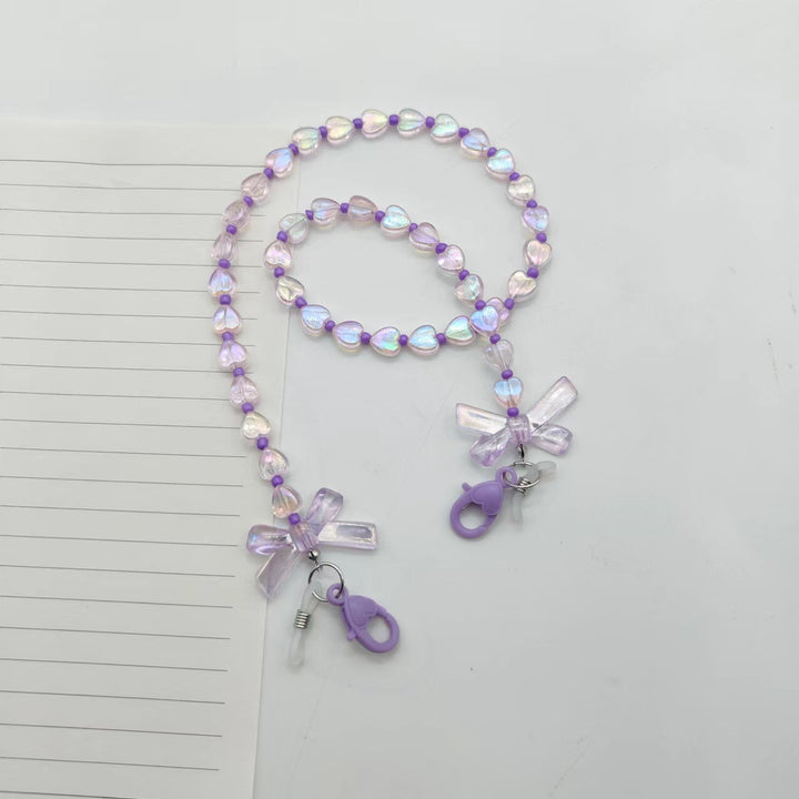 Fashionable glasses holder chain with heart and flower motifs Stornfield