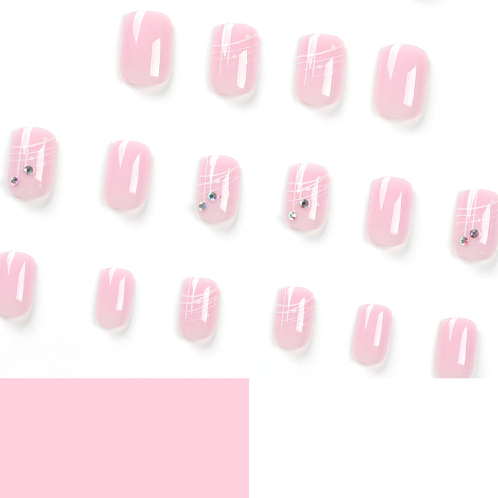 Artful nail extensions with elegant design and rhinestone embellishments Stornfield