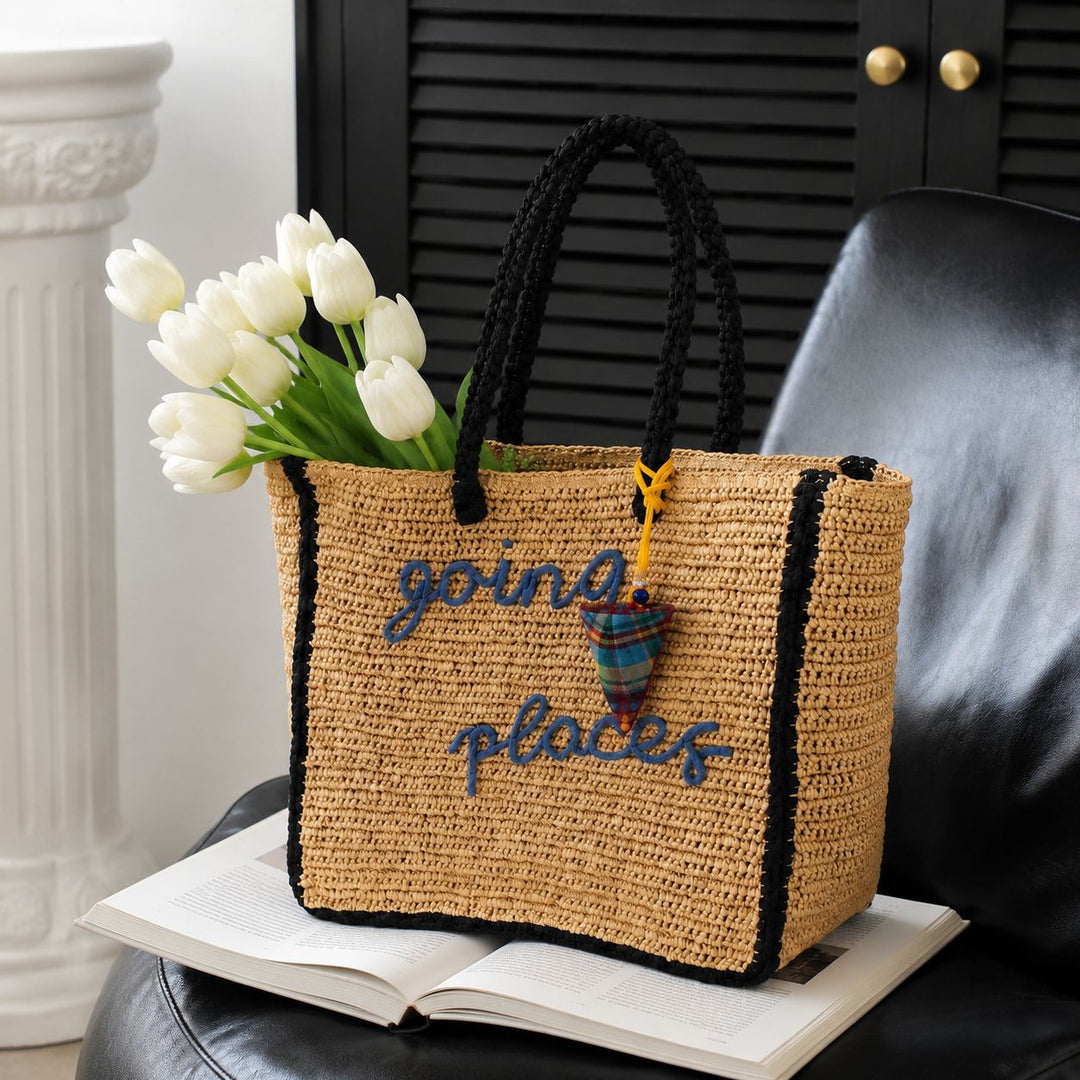 Leisure bag made of woven natural material with colorful pendant Stornfield