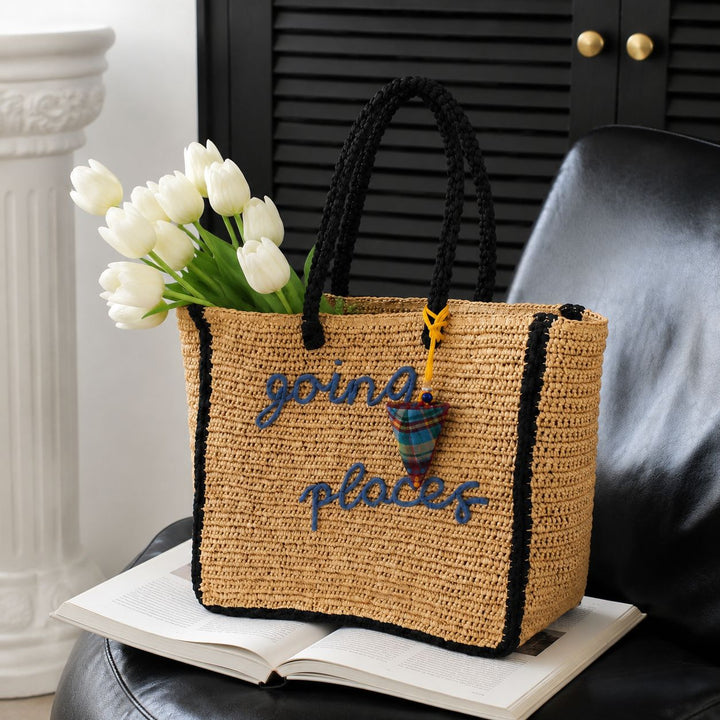 Leisure bag made of woven natural material with colorful pendant Stornfield