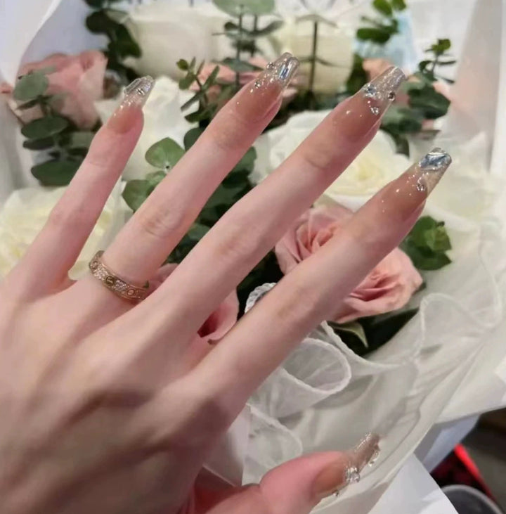 Elegant nail design with pearl embellishment Stornfield