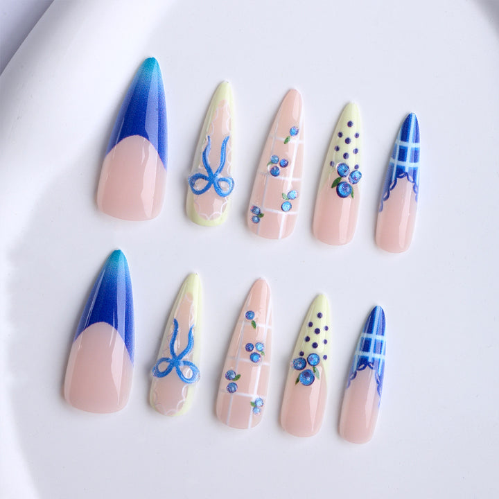 Artificial nails with playful design and elegant accents Stornfield
