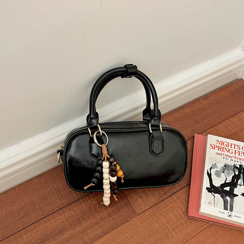 Vintage-Inspired Glossy Handheld Satchel