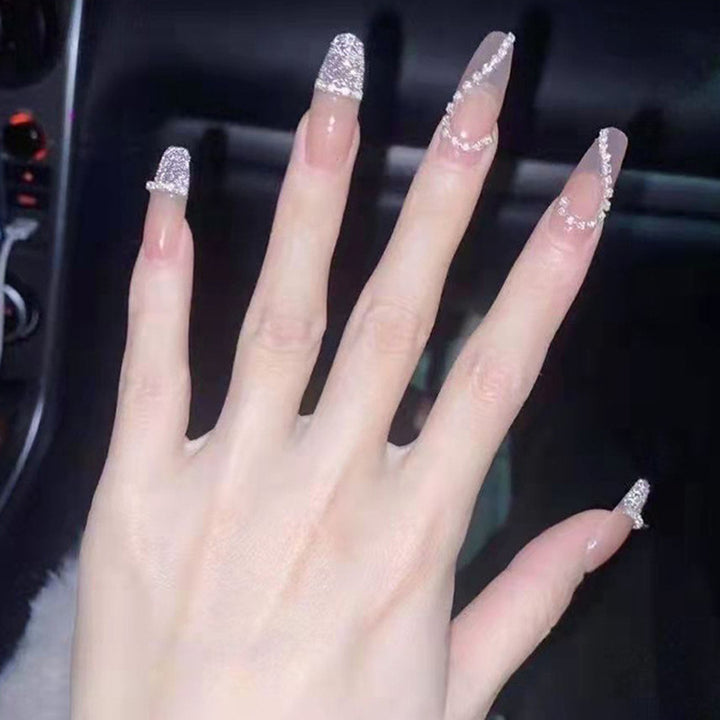 Glamorous artificial nails with heart and glitter design Stornfield