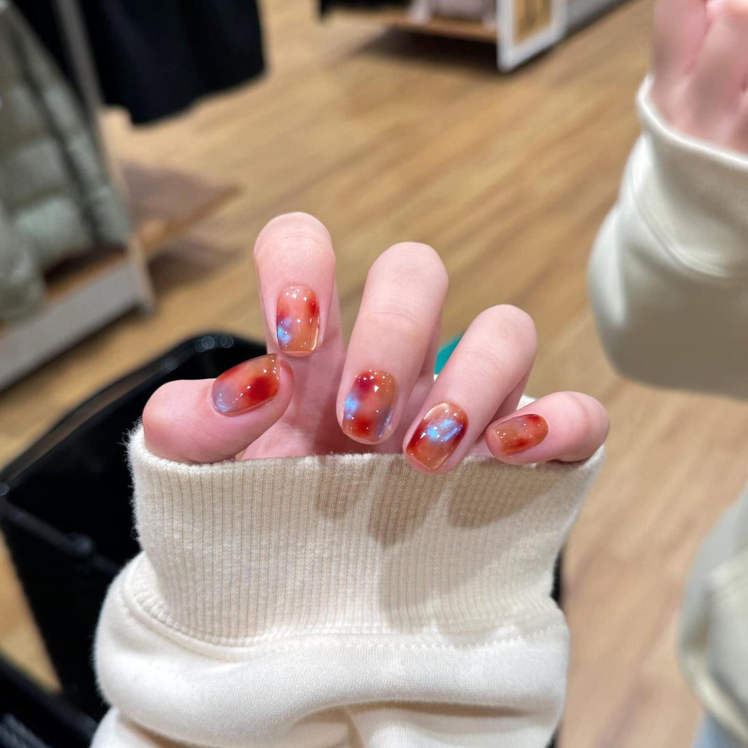 Artificial nails with shimmering galaxy patterns Stornfield