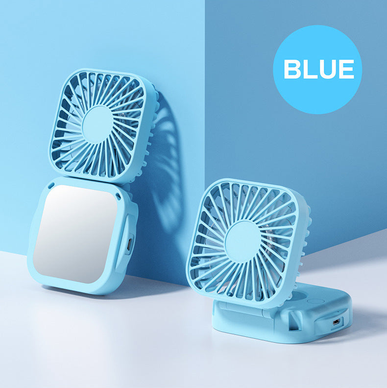 Unisex nan compact foldable clip on handheld desk fan with built in mirror adjustable tilt and USB rechargeable battery Stornfield