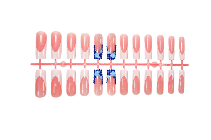 Artificial nail design with trendy blue accents and glitter coating Stornfield
