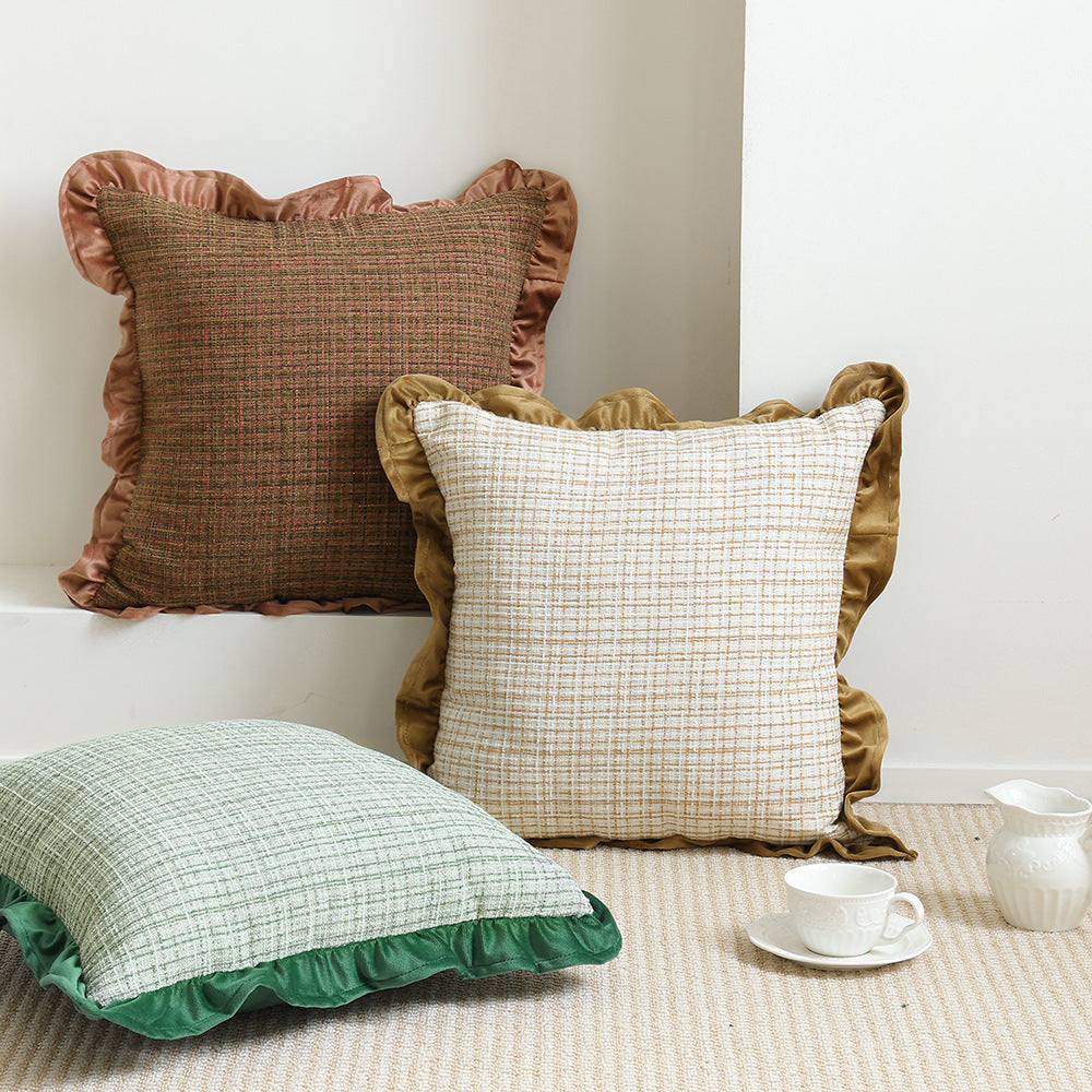 Square decorative pillow with woven linen texture and decorative ruffled edge
