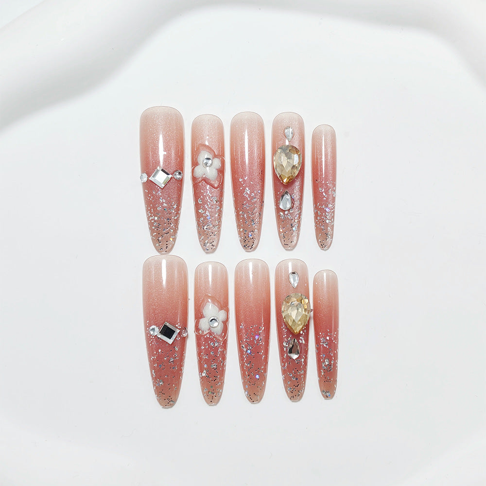 Shiny artificial nails with rhinestones and glitter Stornfield