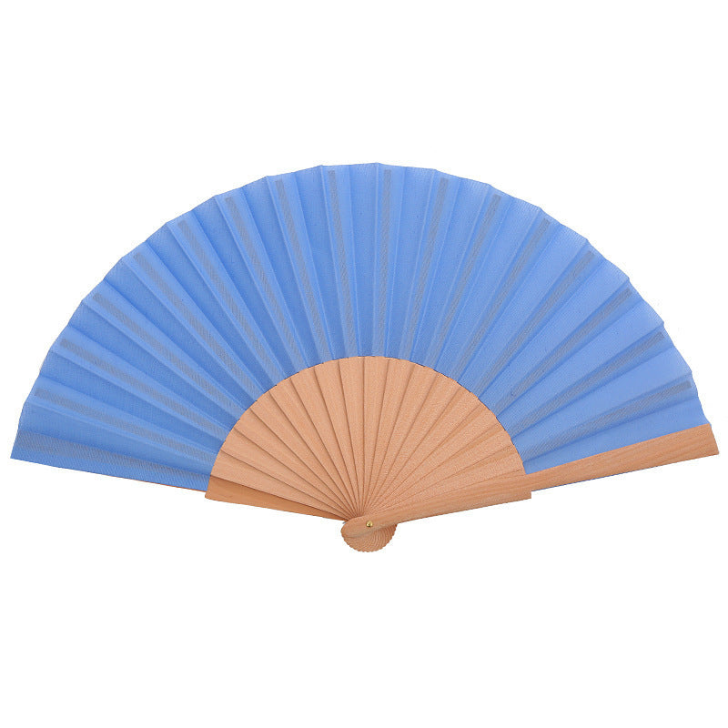 Ladies folding hand fan made of airy material with intricate folds Stornfield