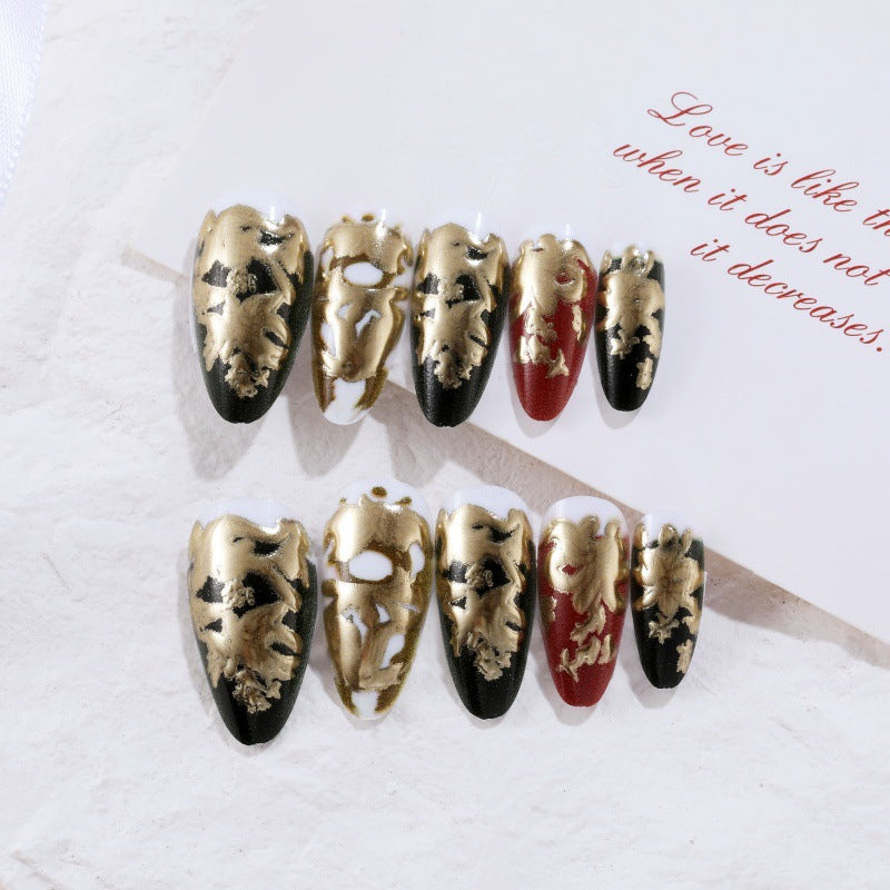 Elegant artificial nails with gold and black pattern Stornfield