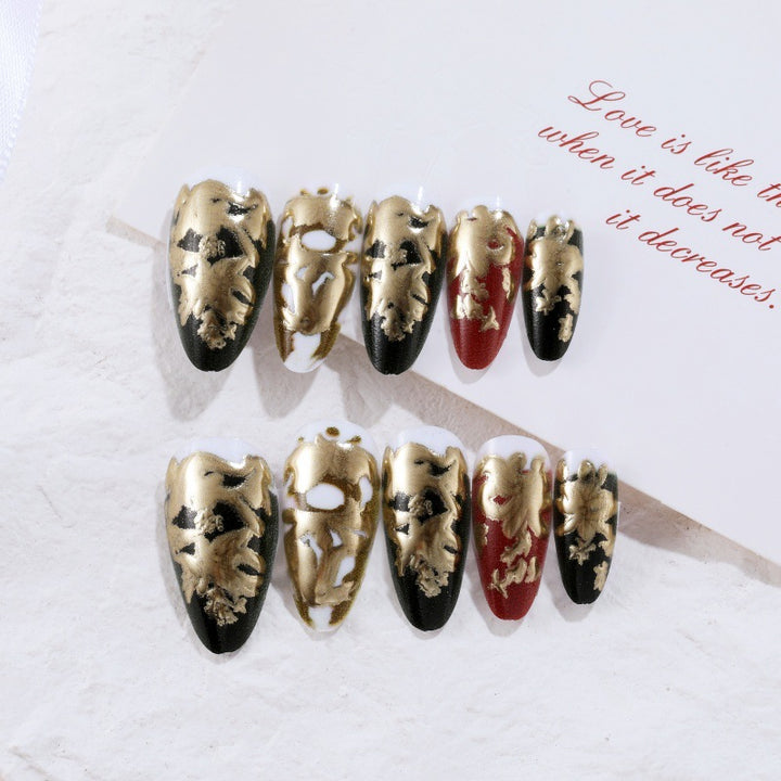 Elegant artificial nails with gold and black pattern Stornfield