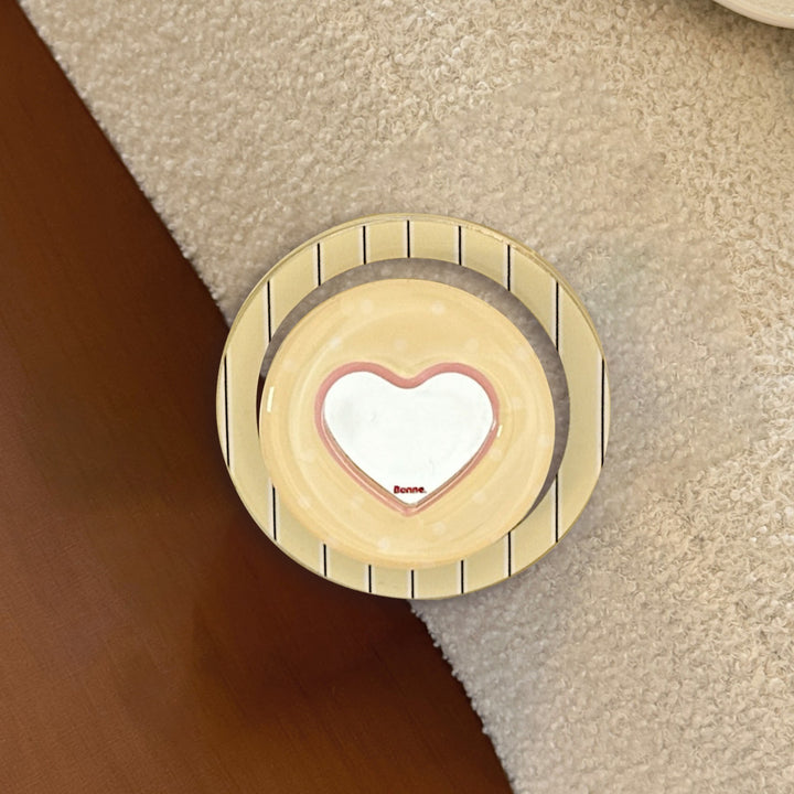 Heart-shaped coaster with playful design Stornfield